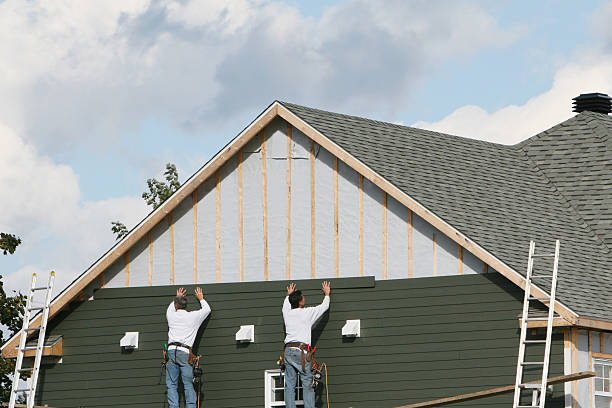 Professional Storm Damage Siding Repair technician working in Bowmansville, PA